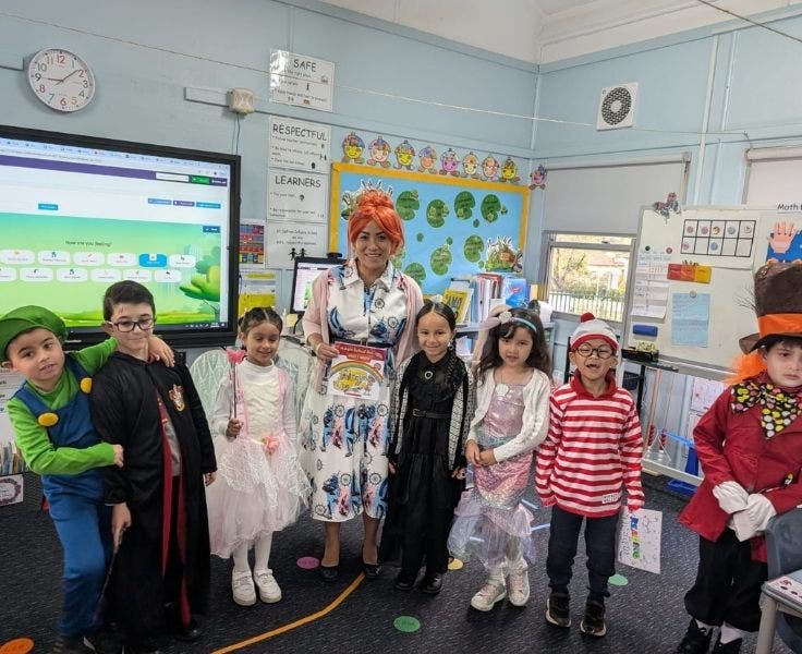 Seven students and a teacher dressed in a range of Book Week costumes.